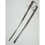 An Imperial German army artillery officer's dress sword, having a heavily etched and blued blade
