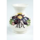 A Fuscia pattern Moorcroft vase, of compressed form with a cream body, impress marks, 9.5 cm