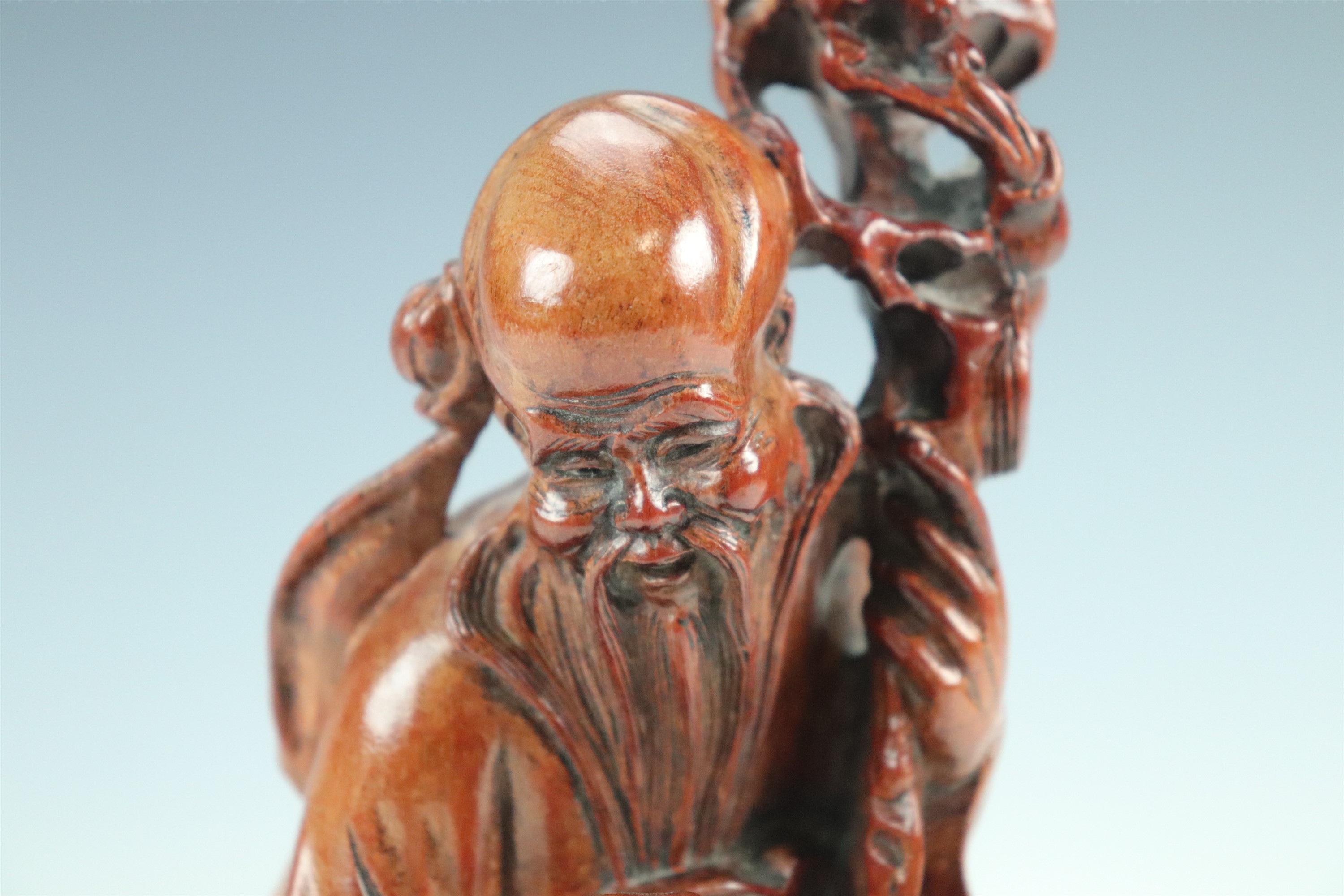 A late 20th Century Chinese carved wood figure of an Immortal, 26 cm - Image 2 of 2