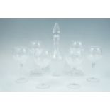 A Stuart Crystal decanter together with six large wine glasses, 21 cm