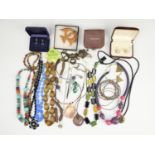 A quantity of 20th Century costume jewellery, including faceted wooden bead necklace, a hardstone