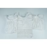 Two mid 20th Century christening gowns, together with a lace bib