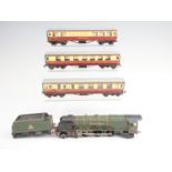 A Hornby Dublo model railway locomotive and tender together with three carriages