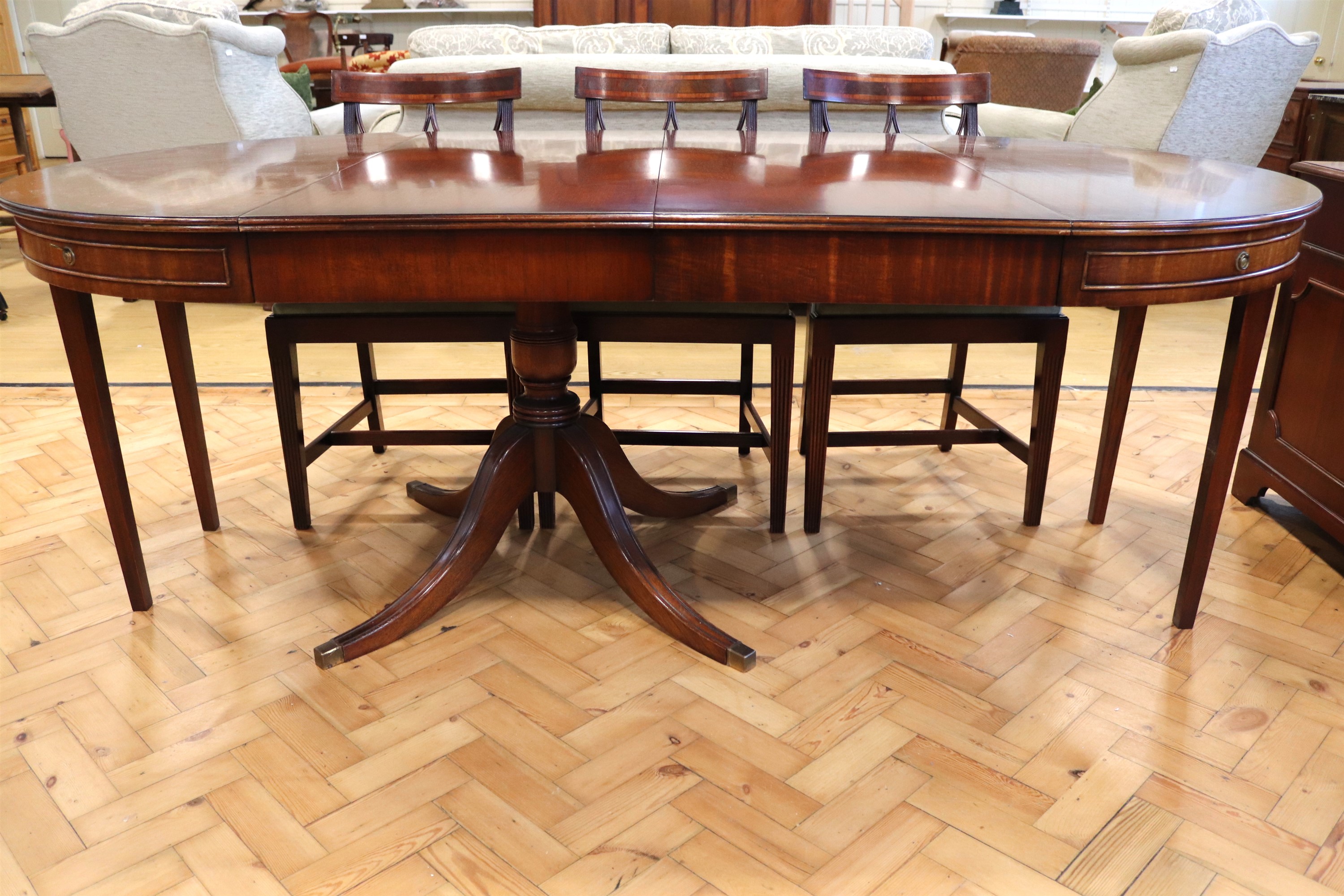 A reproduction Georgian dining suite, comprising a cross-banded mahogany single pedestal dining - Image 2 of 3