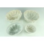 Four jelly moulds