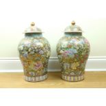 A pair of late 20th Century Chinese famille rose lidded vases, 51 cm