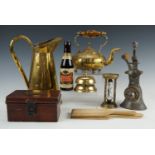 A group of kitchenalia and bygones including a brass egg timer, a mincer etc