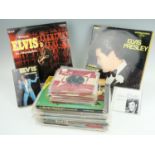 A quantity of Elvis Presley singles, three albums and books etc