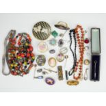 A quantity of vintage and costume jewellery, including a millefiori glass bead necklace, a ceramic