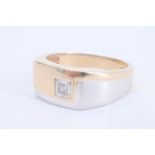 A two-colour 9 ct gold signet ring, its face set with a small diamond, T/U, 6.5 g