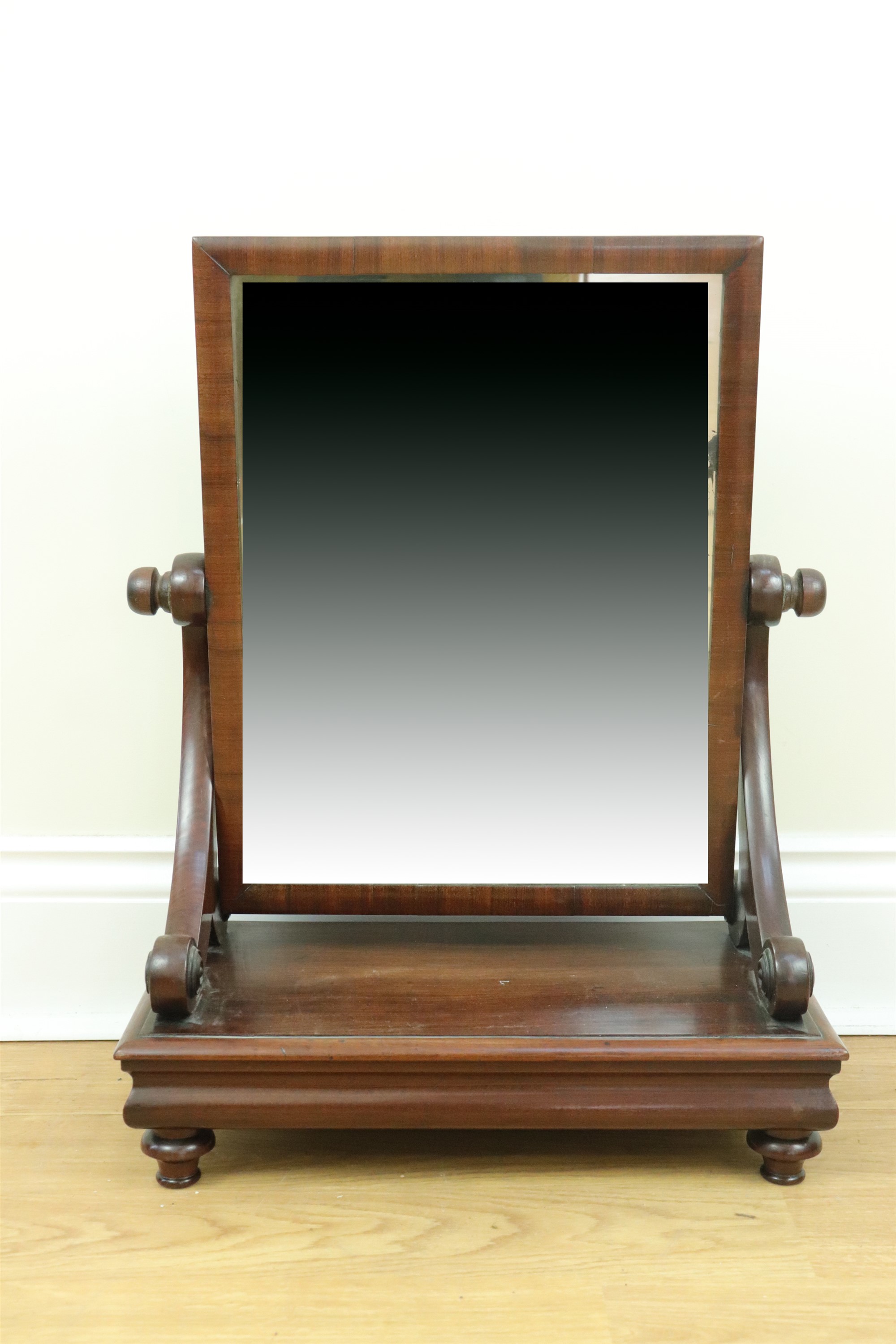 An early Victorian mahogany swivel toilet mirror