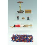 A group of sewing accessories, including a quantity of wooden beads, a vintage wooden thread