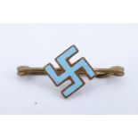 An enamelled gilt metal swastika pin brooch, 26 mm