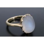 An antique moonstone cabochon finger ring, the oval cabochon of approx 11 mm x 8 mm claw-set on a 15