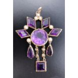 An early 20th Century amethyst, pearl and yellow metal pendant, comprising a central round-cut stone