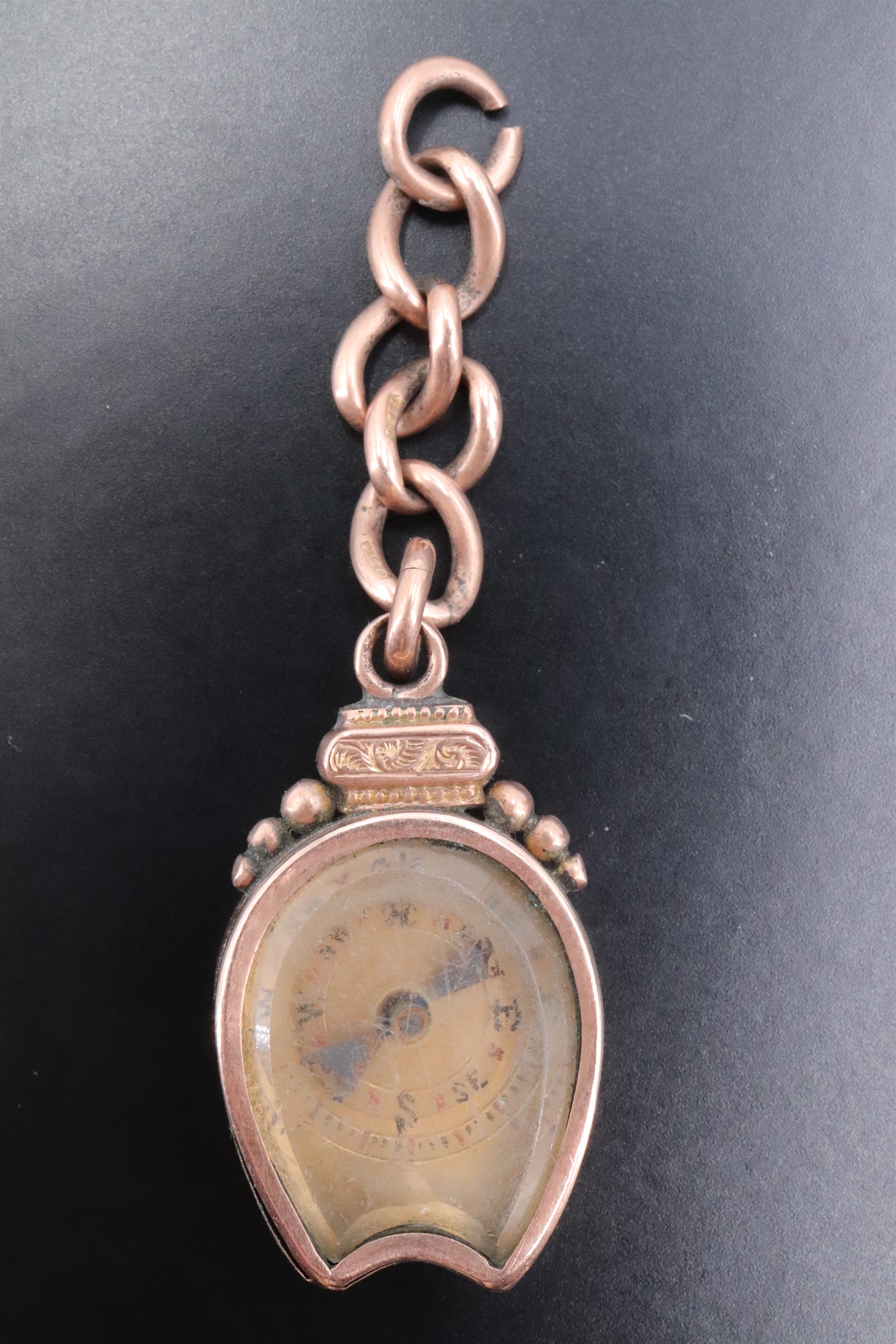 A Victorian 9 ct gold novelty watch chain fob, incorporating a magnetic compass and a relief- - Image 2 of 2