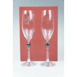 A boxed pair of Schott Zwiesel gilt and green glass collared champagne flutes, 22 cm
