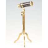 A reproduction leather bound brass three draw telescope and tripod, 34 cm, (a/f)