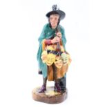 A Royal Doulton figurine "The Mask Seller", HN 2103, 22 cm