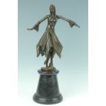 An Art Deco style cast bronze figure of a female dancer in the manner of Chiparus, on a tapering