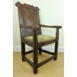 A reproduction 17th Century wainscot type joined oak armchair