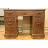 A late 19th / early 20th Century oak pedestal desk, 107 cm x 59 cm x 77 cm