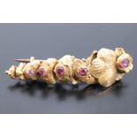 A Victorian pink semi-precious gemstone and yellow metal brooch, 4 cm, 3.7 g