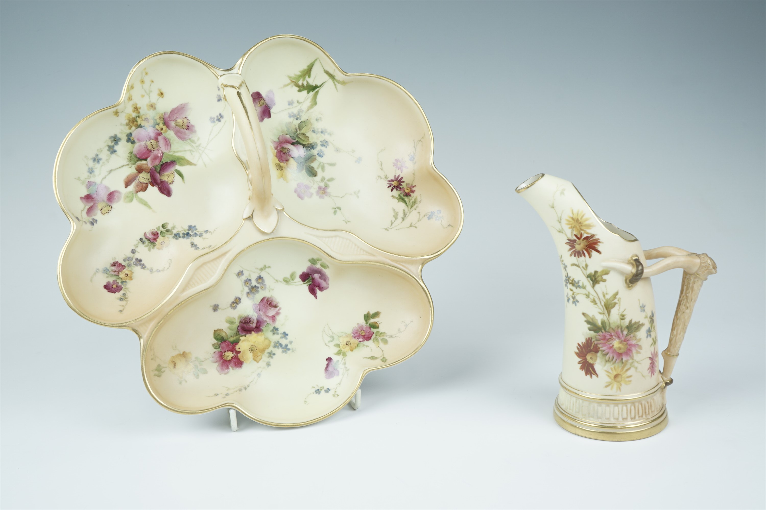 A late 19th Century Royal Worcester blush ivory hors d'oeuvre dish, and an antler jug, design
