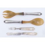 A Victorian mother-of-pearl handled fruit knife and fork together with a set of German 800