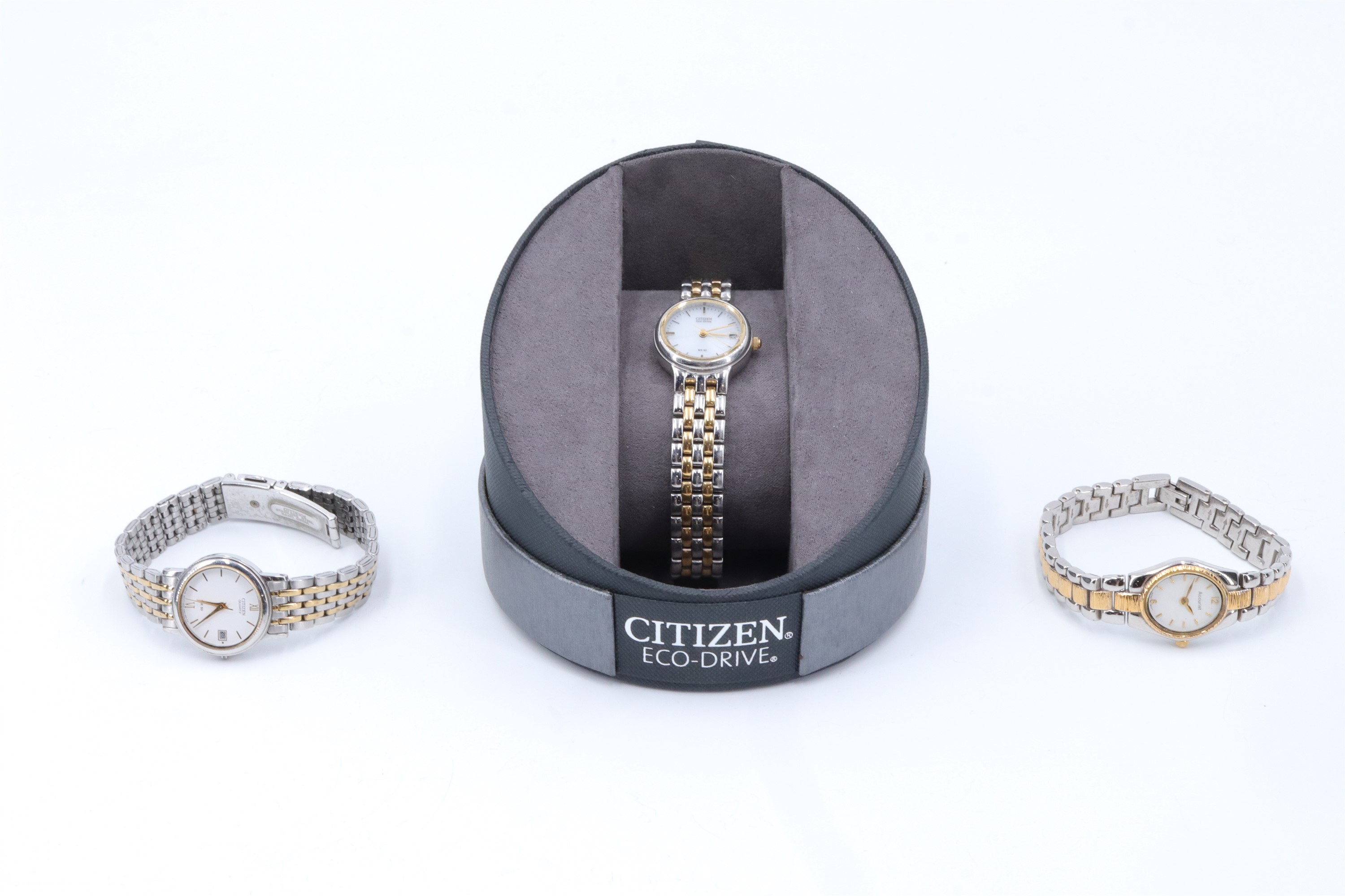 A lady's Citizen Eco-Drive parcel gilt stainless steel wristwatch in original box, together with