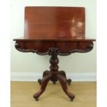 A Victorian mahogany turn-over-top tea table
