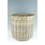 A late 20th Century two handled wicker log basket, 54 x 52 cm excluding the handles