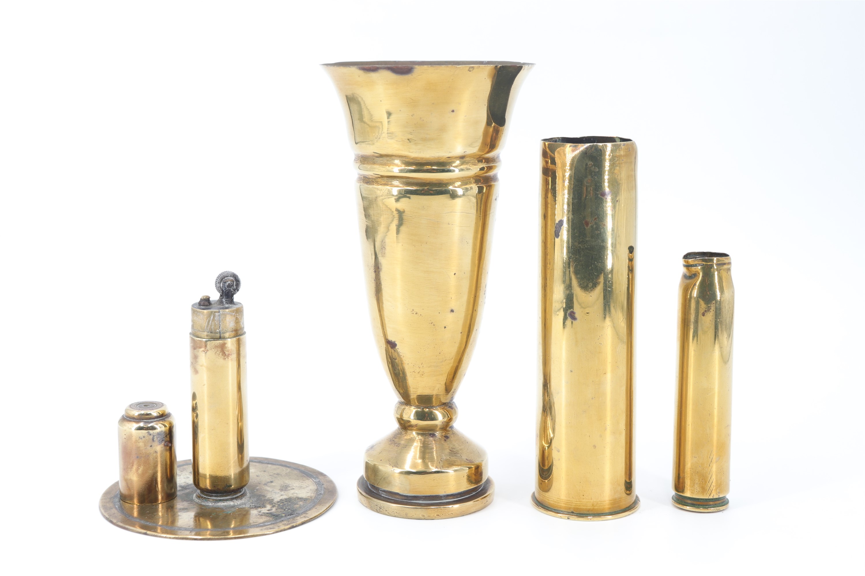 A Second World War trench art table cigarette lighter together with a 1943 trench art vase and inert