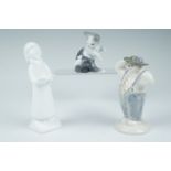 Two Royal Doulton figurines, Stylish Snowman, 13 cm together with Carol Singer Boy, 15 cm, and a