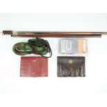 Two modern leather rifle ammunition cases, .410 and 28 bore shotgun bore snakes, and a cleaning rod