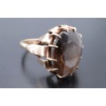 An Edwardian smoky quartz dress ring, the stone being approximately 10 carats and prong set on a