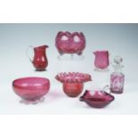 Seven items of cranberry glass including bowls, scent bottle etc