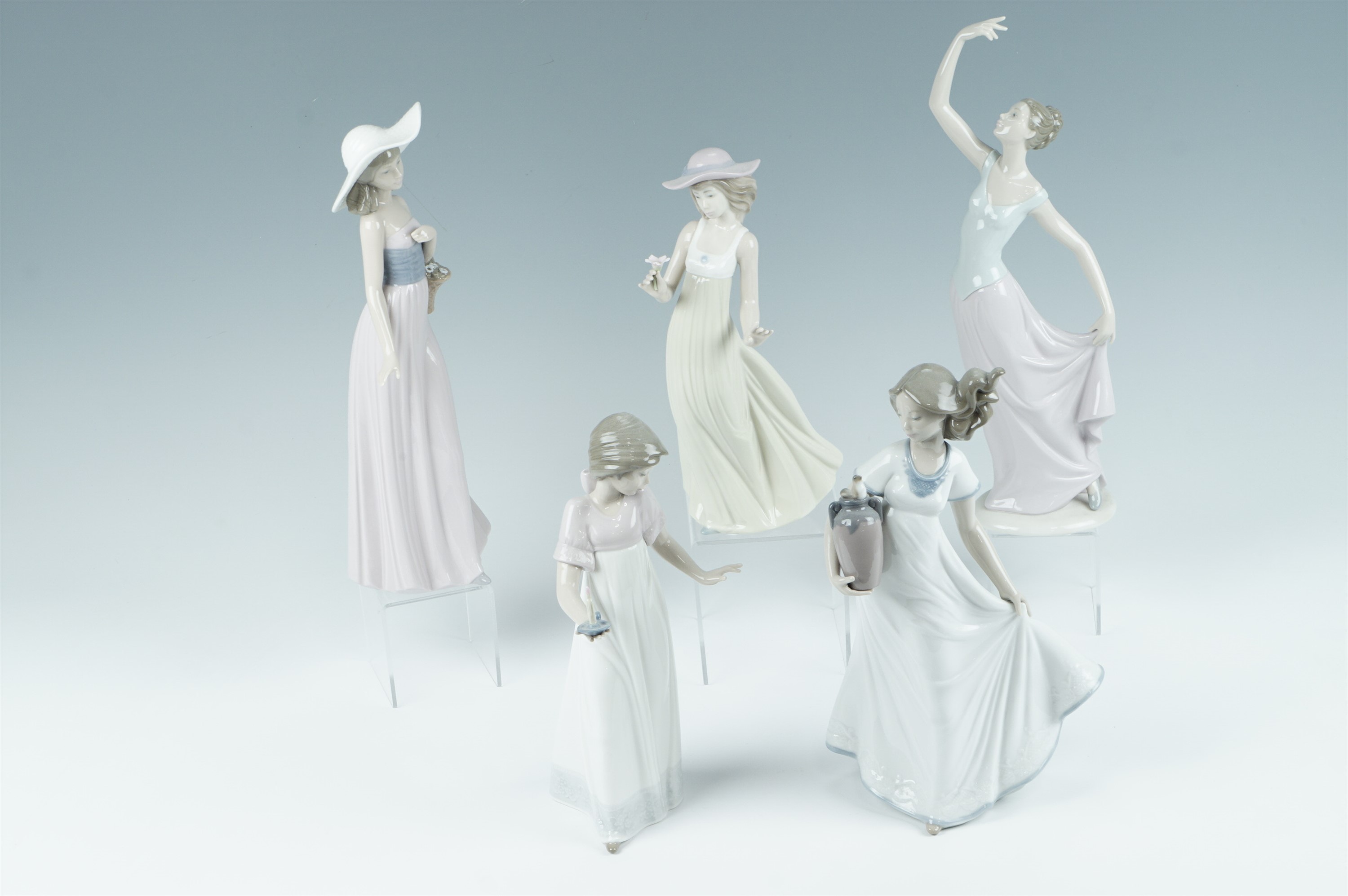 Five Nao figurines including Candlelight, tallest 35 cm