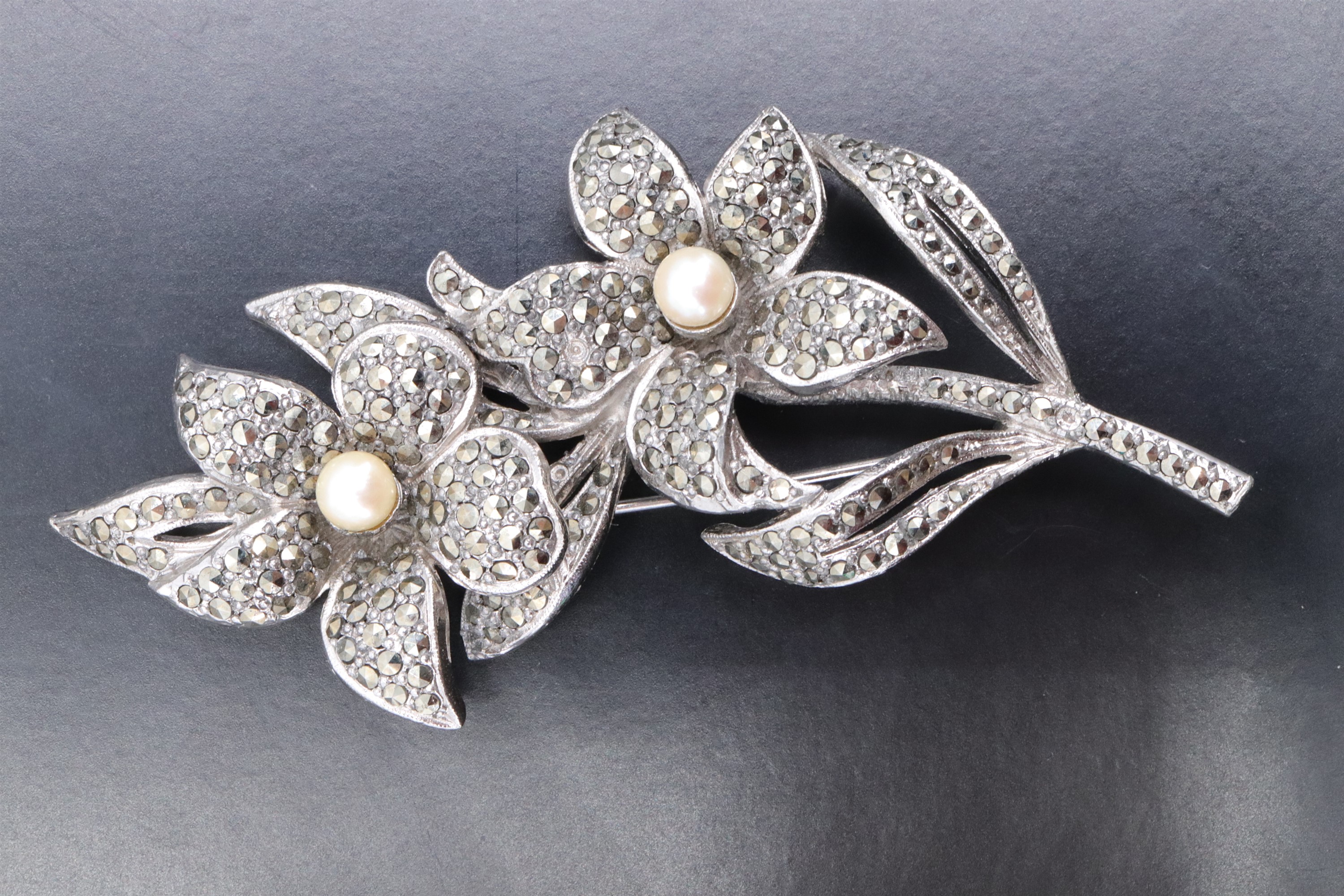 A white metal marcasite floral brooch, set with a cluster of six garnets, and a similar costume - Image 5 of 6