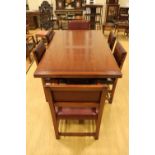 A late 20th Century substantial oak extending dining table with a set of six Reprodux Puritan