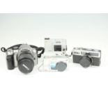 A group of cameras, comprising a Fujica Compact 35, a Lumix TZ1, a boxed Canon EOS 300D digital, a