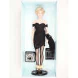 A Franklin Mint limited edition "Diana, Princess of Glamour" portrait doll in original packaging,