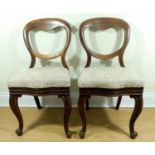 A pair of Victorian mahogany balloon back dining chairs