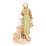 A late 19th Century Royal Worcester blush ivory figure of a maiden leaning on a vase, with a jug