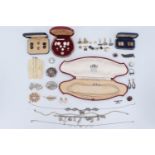 A quantity of vintage costume jewellery including a silver charm bracelet, a marcasite and white