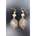 A pair of Victorian pearl, rock crystal and yellow metal ear pendants, each comprising an oval