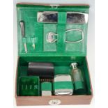 A vintage cased travel grooming set