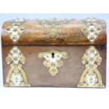 A Victorian walnut veneered dome top two compartment tea caddy, decorated with ivory, and pierced