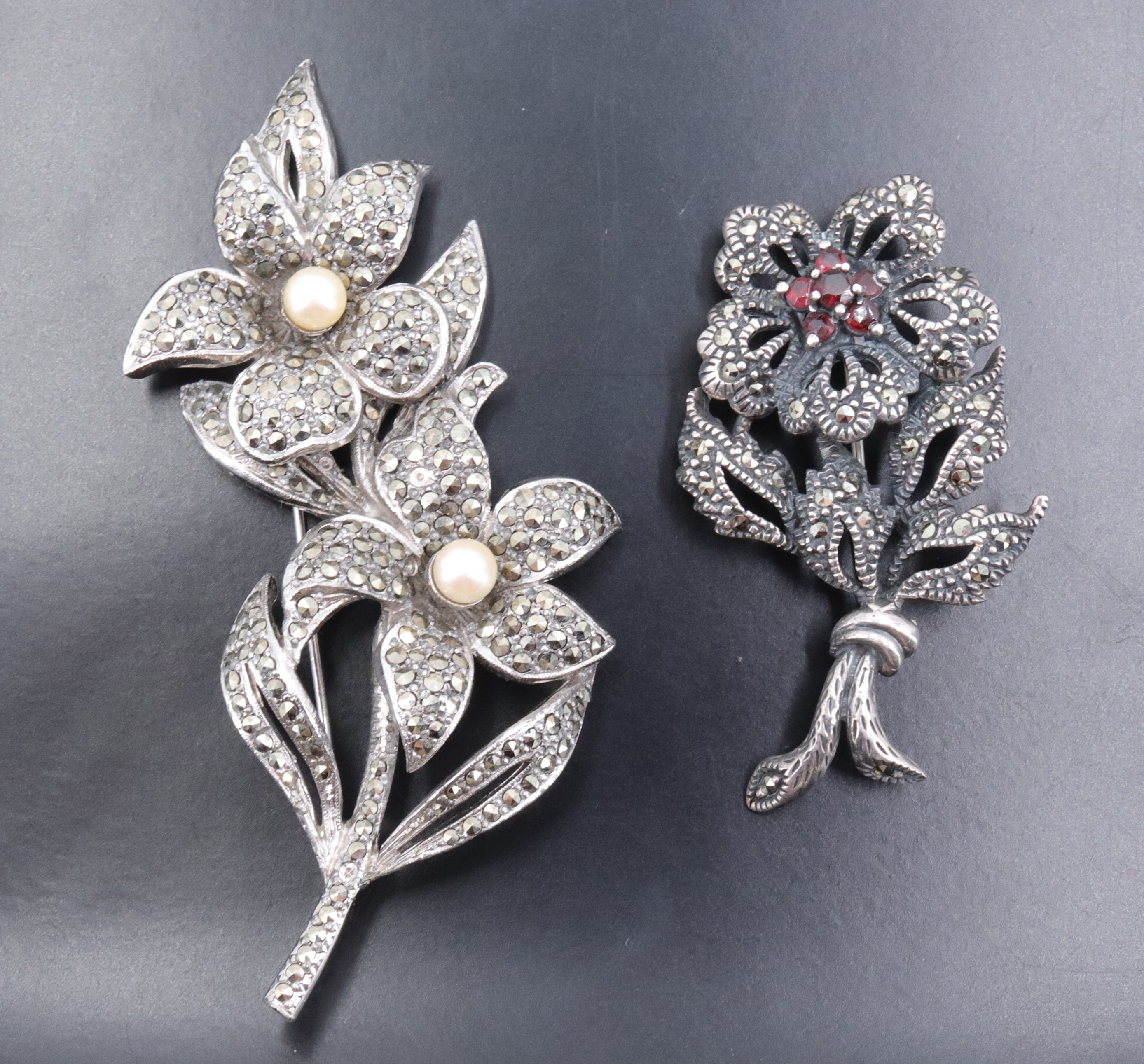 A white metal marcasite floral brooch, set with a cluster of six garnets, and a similar costume - Image 2 of 6