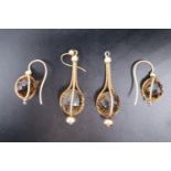 Two pairs of 9ct yellow metal caged faceted smoky quartz ear pendants, (one hook lacking), 30 mm x
